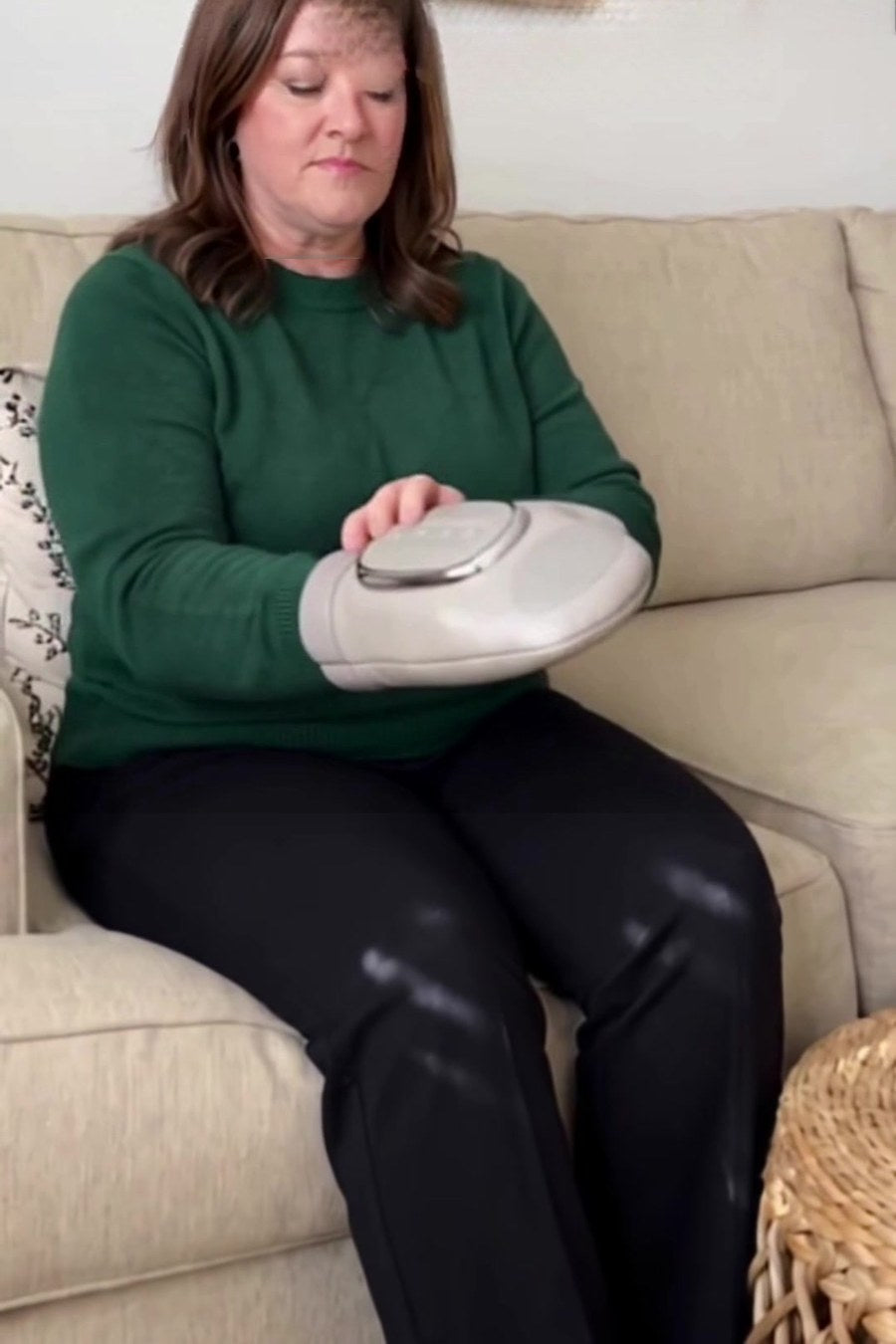 Woman relaxing with the Cozy Clasp hand massager
